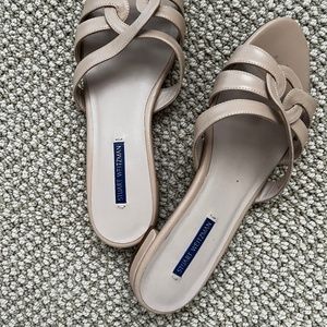 Stuart Weitzman flat sandals.